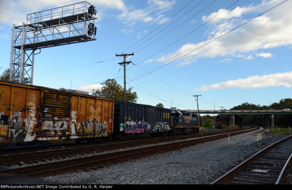 CSX local L206 heads east toward Sandy Hook Yard.  US 29 Business, Carter Glass Bridge, looms ahead.